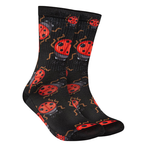 Calcetines negros con estampado de mariquitas rojas, aportando un toque delicado y natural a tu estilo.