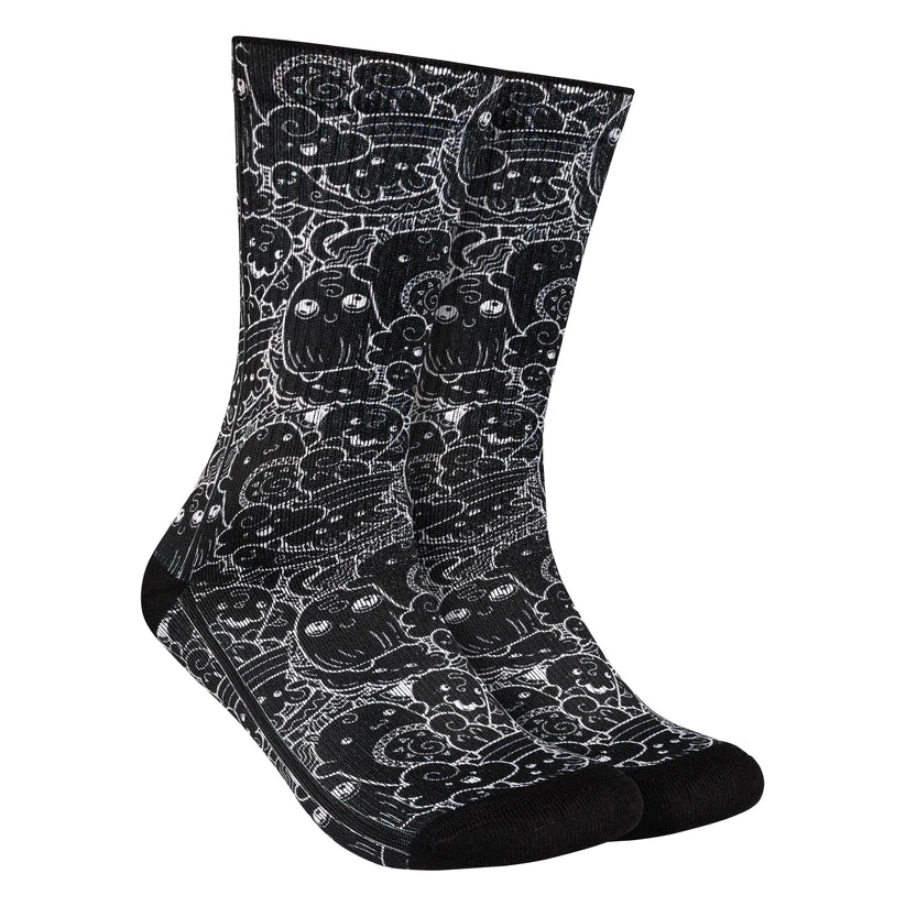 Calcetines negros con diseño de galletas animadas alegres, perfectos para los amantes de los dulces.